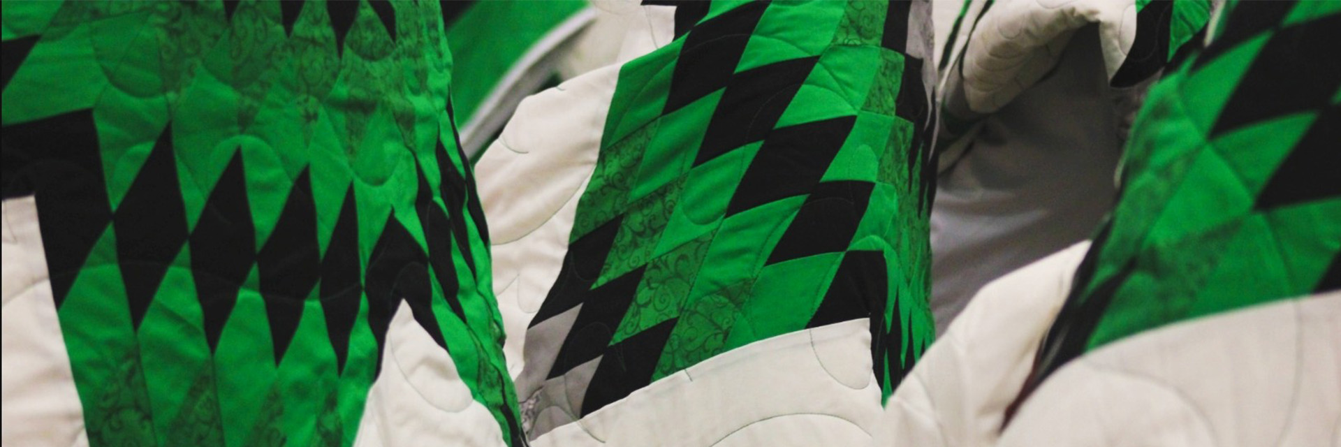 Artistic quilt featuring University of North Dakota coloring.